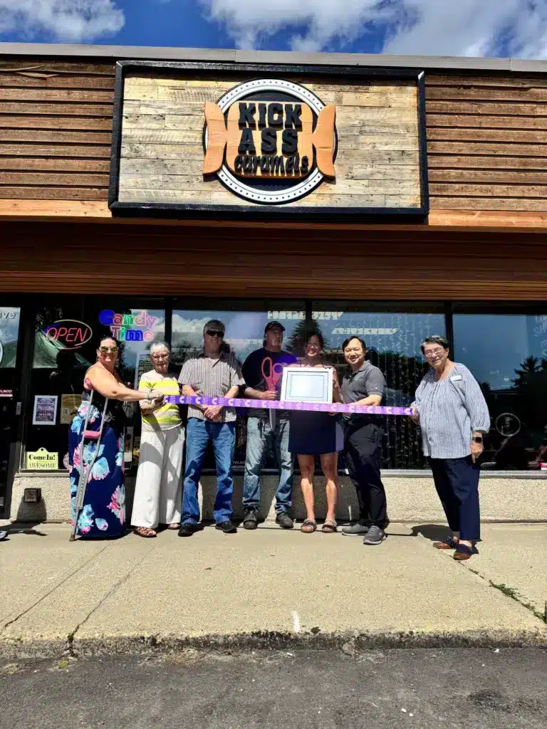 Grand opening ribbon cutting outside the Kick Ass Caramels shop