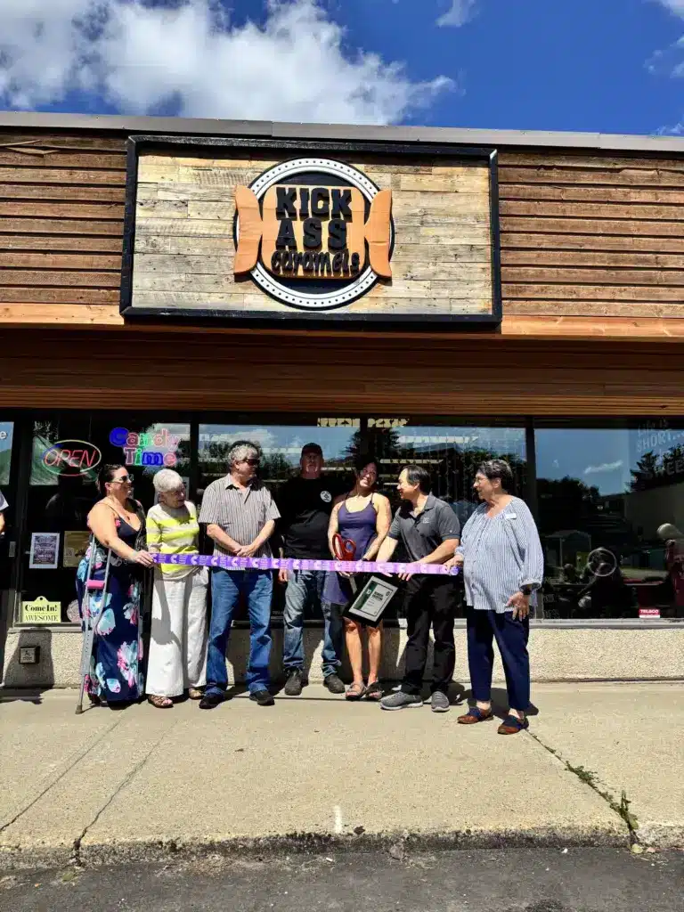 Grand opening ribbon cutting outside the Kick Ass Caramels shop