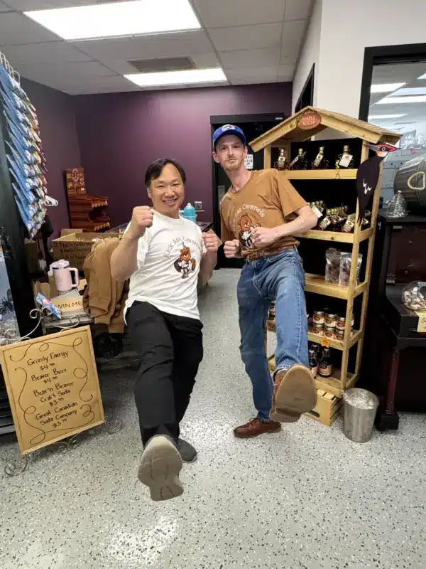 Two of the team striking a kick ass pose in the shop